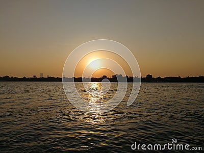 the sun setting down with river view Stock Photo