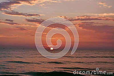 Sun setting just in middle of a ocean in Goa Stock Photo