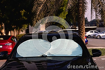 sun shade or sun reflector on the windshield the car Protective reflective Stock Photo