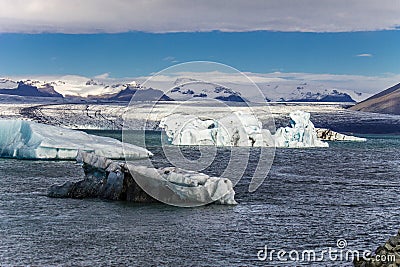 Large Ice burgs float effortlessly around Jokulsarlon Glacier Lagoon in Iceland Stock Photo