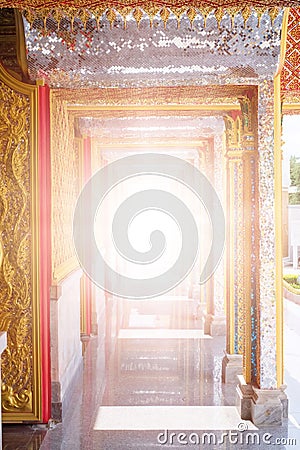 The sun shining through Thai arch architecture golden style. Heaven gate. I Stock Photo