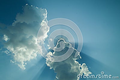 Sun, Sunbeam, Cloud and Blue Sky. Background and Texture. Stock Photo