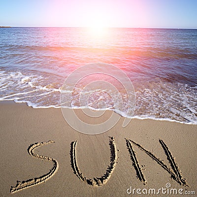 Sun written on wet sand Stock Photo