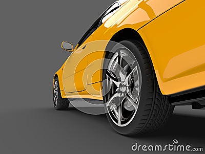 Sun yellow urban sports car - rear wheel closeup shot Stock Photo