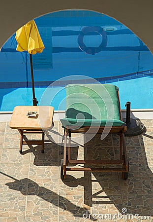 Sunbathing chair and unbrella Stock Photo