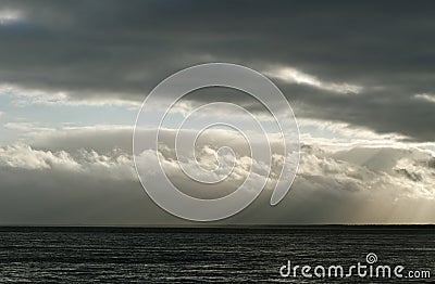 Sunbeam above sea. Stock Photo