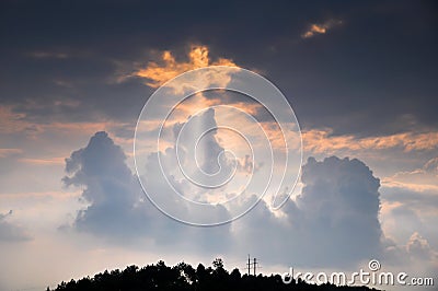 Sunbeams through rosy clouds Stock Photo