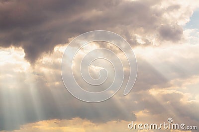 Sunbeams shine through the clouds Stock Photo