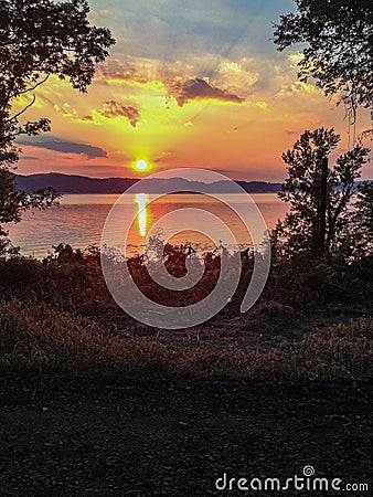 Sunbeams and Sunset Reflecting over the Susquehanna River Stock Photo