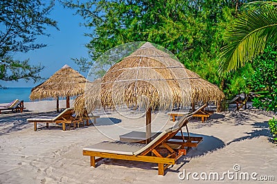 Sunbed and umbrella on Tropical beach on the island of Sihanoukville Stock Photo