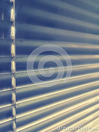 Sunblinds Silver aluminum louver on window horizontal pattern. Shutters On glass In The Office or home interior Stock Photo