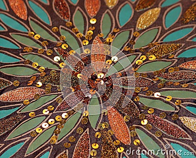 Sunburst Pattern of Sequins, Beads and Feathers Stock Photo