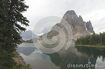 Sunburst Peak with Mount Assiniboine Smoke from fires Stock Photo