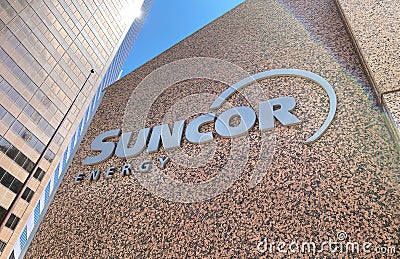 A Suncor Energy sign outside of a building in Downtown Calgary Editorial Stock Photo