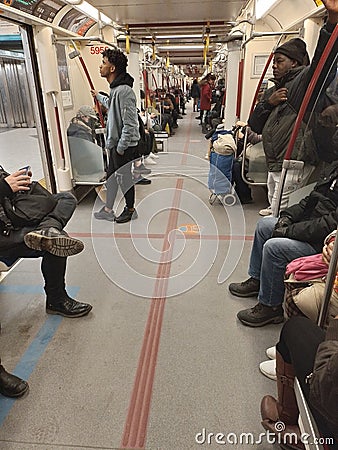 Sunday February 19th on the subway in Toronto Ontario Canada passengers on line 1 on the ttc or the Toronto transit commission Editorial Stock Photo