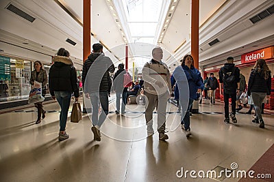 People shoppers inside a modern shopping centre mall walking Editorial Stock Photo