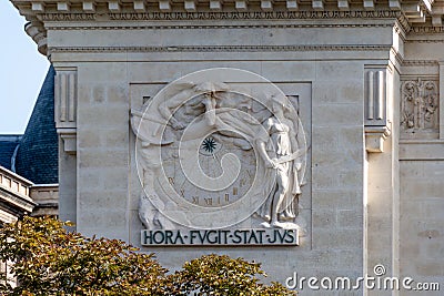 Sundial on the facade of the Palais de Justice (courthouse) of Paris, France Editorial Stock Photo