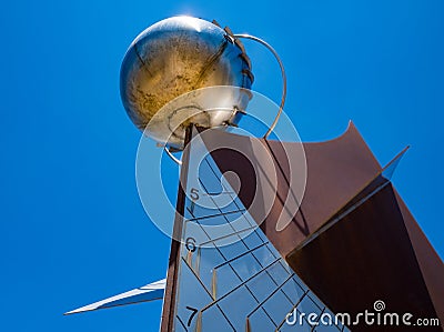 Sundial in the form of a sphere or planetoid like a plane Stock Photo
