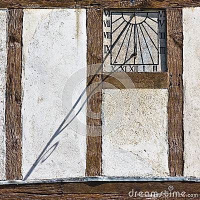 Sundial on Side of Building Stock Photo