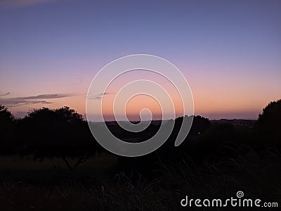 Sundown over golf course Stock Photo