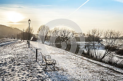 Sundown over walway in winter time Stock Photo