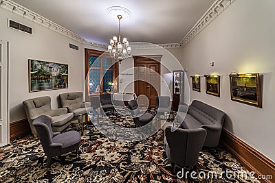 Sundsvall, Vastnorrland County - Decorated interior design of a hotel lobby room with a vintage sofa and chimney Editorial Stock Photo