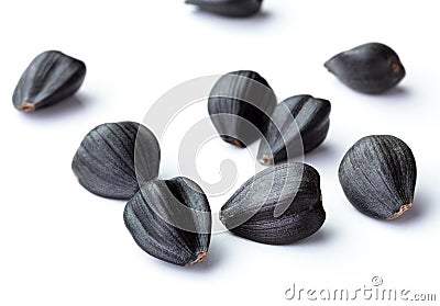 Sunflower black seeds in group isolated white background Stock Photo