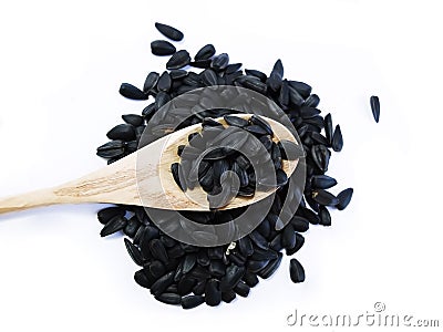 Sunflower Black Seeds in Wooden Spoon Stock Photo