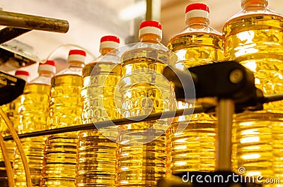 Sunflower oil. Factory line of production and filling of refined oil from sunflower seeds. Factory conveyor of food industr Stock Photo