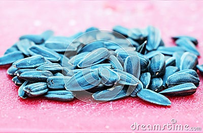 Sunflower seeds on a red background Stock Photo