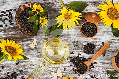 Sunflowers, bottle with oil and sunflowers seed Stock Photo