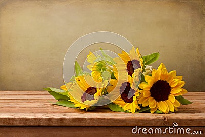 Sunflowers on wooden table Stock Photo