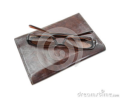 Sunglasses atop billfold Stock Photo