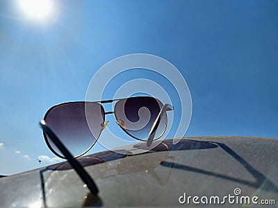 Sunglasses in the blue sky Stock Photo