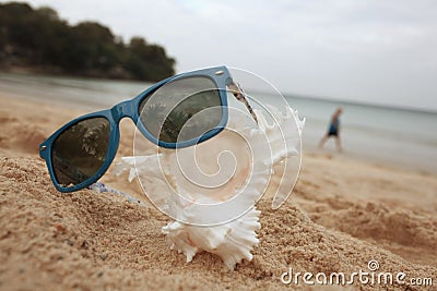 Sunglasses on sandy beach Stock Photo