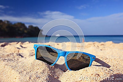 Sunglasses on sandy beach Stock Photo