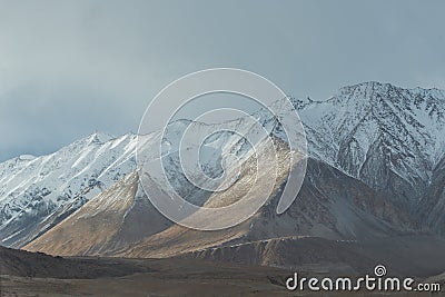 Sunlight cast on mountain range Stock Photo