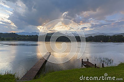 Sunlight and clouds reflect on the water Stock Photo