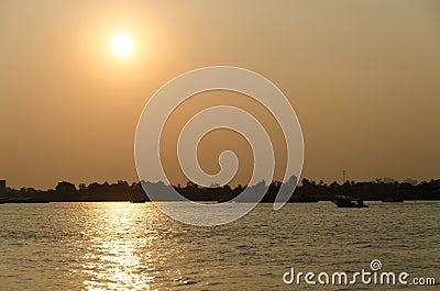 The sunlight hit the sparkling water in the evening Stock Photo