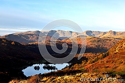 Sunlight on the Langdale fells Stock Photo