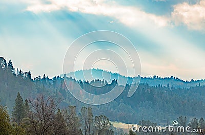 Sunlight Shinning Through the Clouds Stock Photo