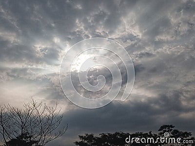 sunlight that slowly appears behind the clouds Stock Photo