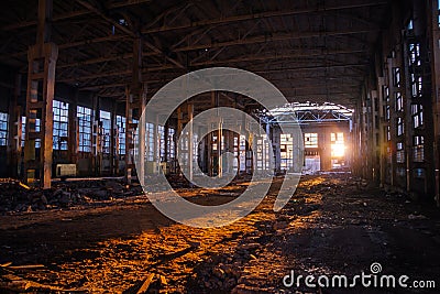 Sunlight of sunset in large abandoned industrial building of Voronezh excavator factory Stock Photo