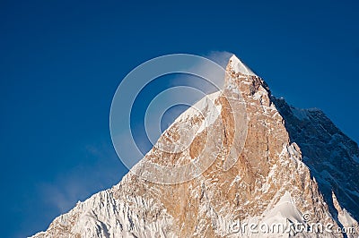 Sunlight on top of Masherbrum mountain peak in a morning, Goro I Stock Photo
