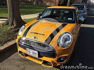 Sunlit Orange Mini Cooper Sports Car With Racing Stripes Editorial Stock Photo