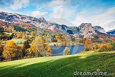 Sunny autumn view of Grundlsee lake. Fantastic morning scene of Brauhof village, Styria stare of Austria, Europe. Colorful view of Stock Photo