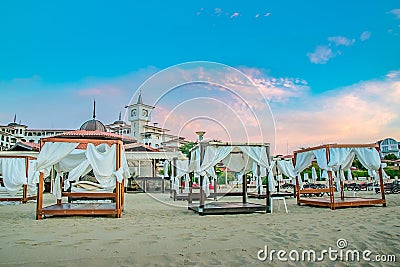 Sunny Beach, Bulgaria - 4 Sep 2018: Umbrellas and chair lounges at sunrise in Sunny Beach, a major seaside resort on the Black Sea Editorial Stock Photo