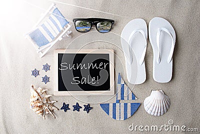 Sunny Blackboard On Sand With Text Summer Sale Stock Photo