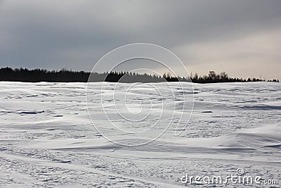 Landscape with snow barkhans. Stock Photo