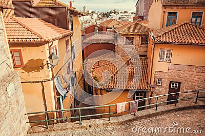 Sunny cityscape with historical houses street and red tile roofs of the big port city Stock Photo